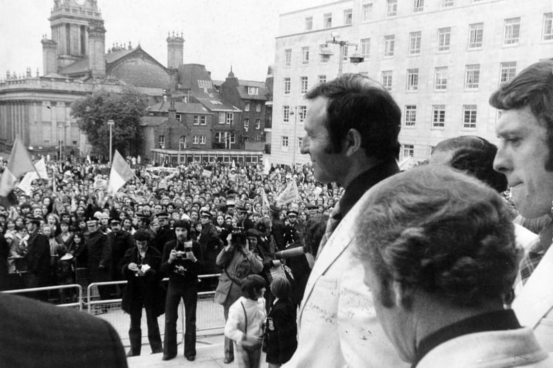 Manager Jimmy Armfield leads out the team to greet supporters on the steps of the Leeds Civic Hall in May 1975.