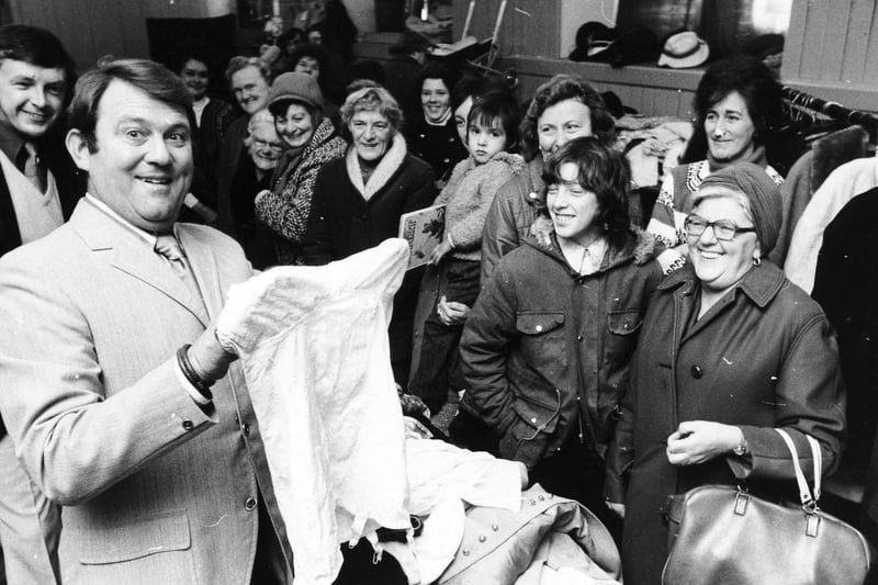 Comedian Terry Scott who was starring in panto at Bradford Alhambra shares a joke opening a bargain sale held by the Pudsey branch of the Save the Children Fund at the Unitarian Church, Pudsey.