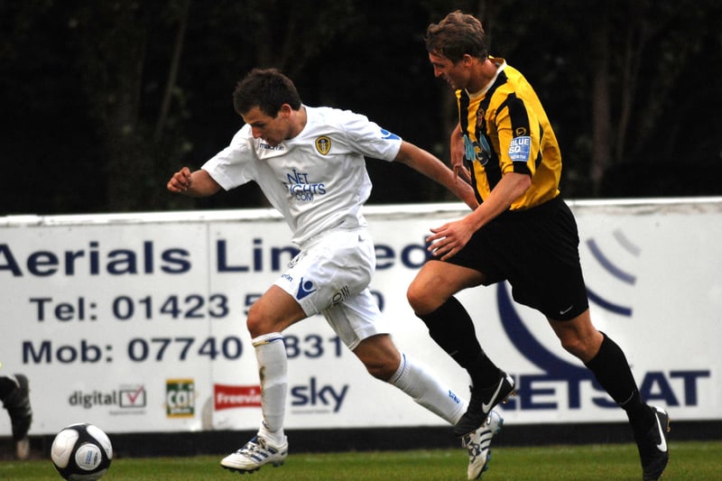 hsb. Harrogate Town player Craig James in action with his Leeds United X1 opponent Will Hatfield. 100810AR1pic3.
