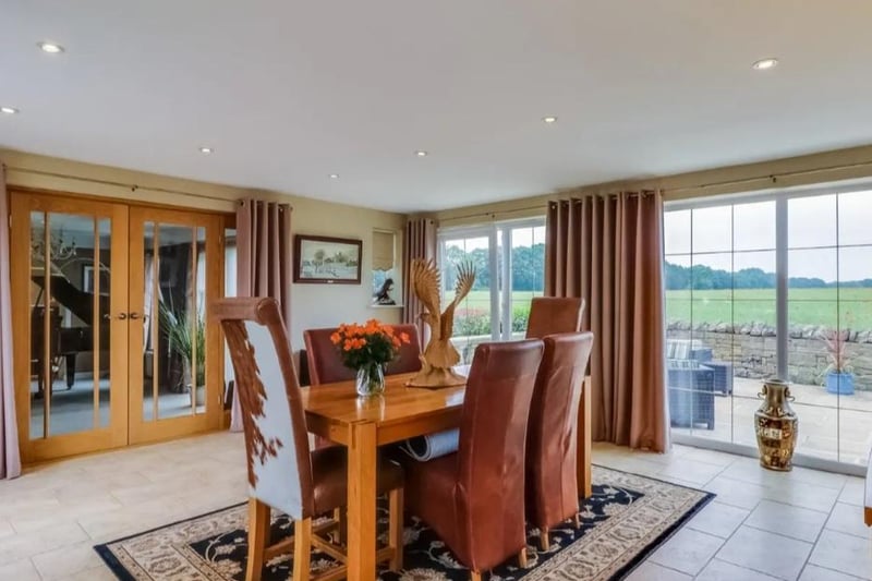 A light and airy reception room having two sets of French doors, further sliding patio doors and double glazed windows, inset spotlights to the ceiling, ceramic tiled floor