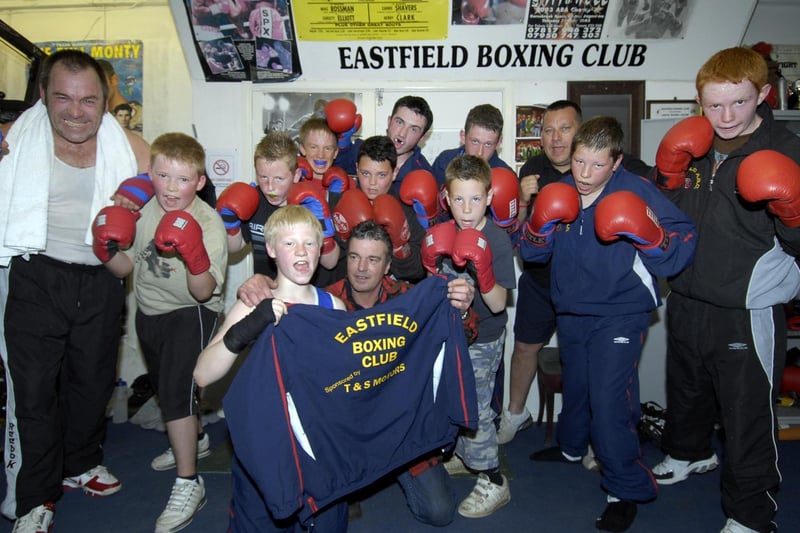 Eastfield Boxing Club receive their new training tops sponsored by Tony Poole, front centre, pictured with boxer Lewis Gledhill, left.