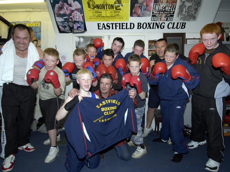 Eastfield Boxing Club receive their new training tops sponsored by Tony Poole, front centre, pictured with boxer Lewis Gledhill, left.