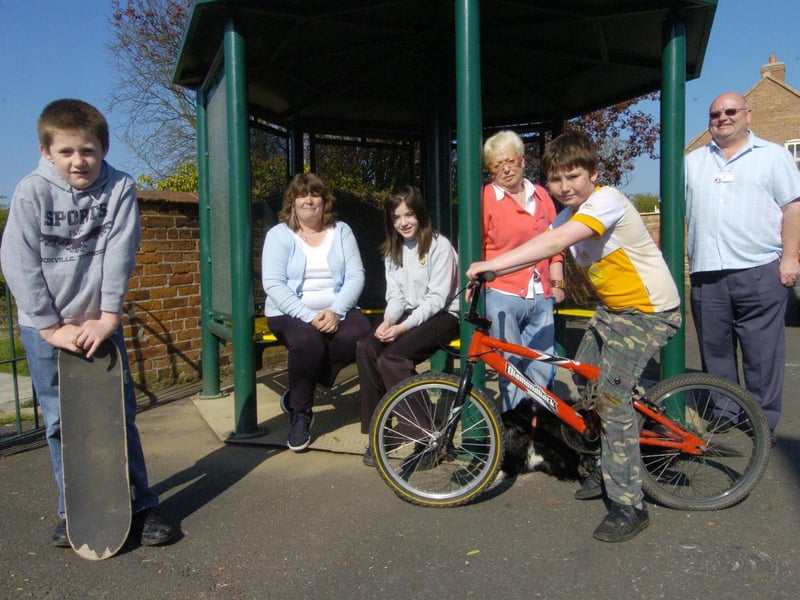 Trying out the Hunmanby youth shelter, from left, Luke Stanger, Cllr Lavinia Kirk, Samantha Stanger, Cllr Liz Mullin, Callum Grimwood, and John Casey.