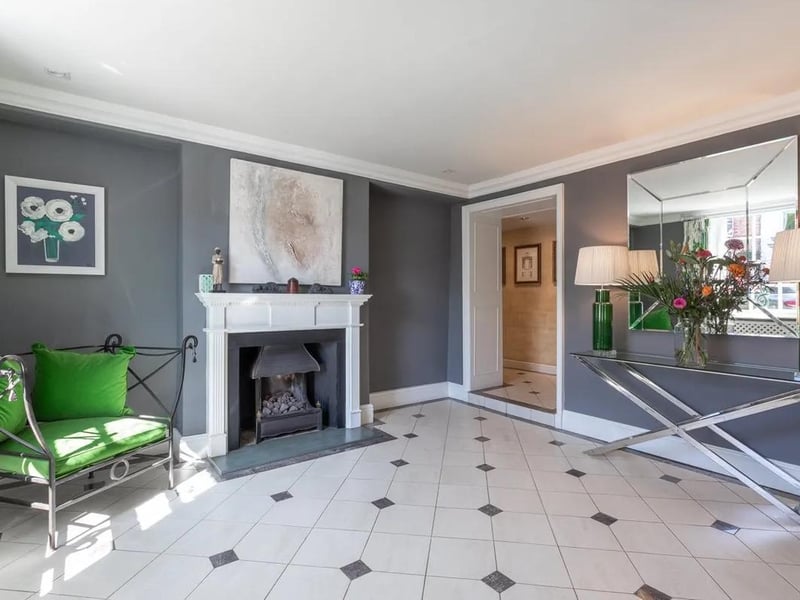 There is a contemporary feel inside the house, but it combines with period features such as this fireplace.