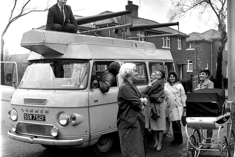 Residents of Beech Hill gather to watch the TV detector van in operation around the housing estate in 1970