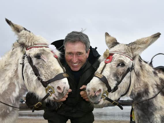 Guy Smith and his donkeys on South Bay beach.