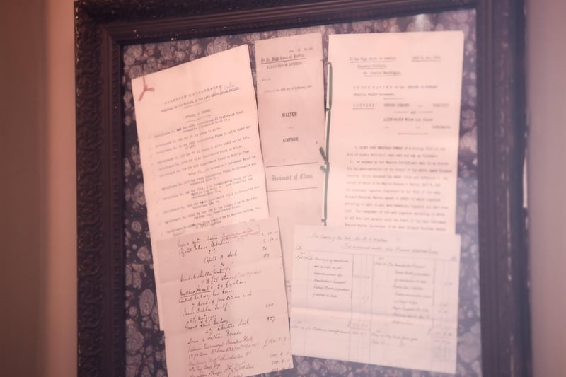 Framed historic documents from the former bank.