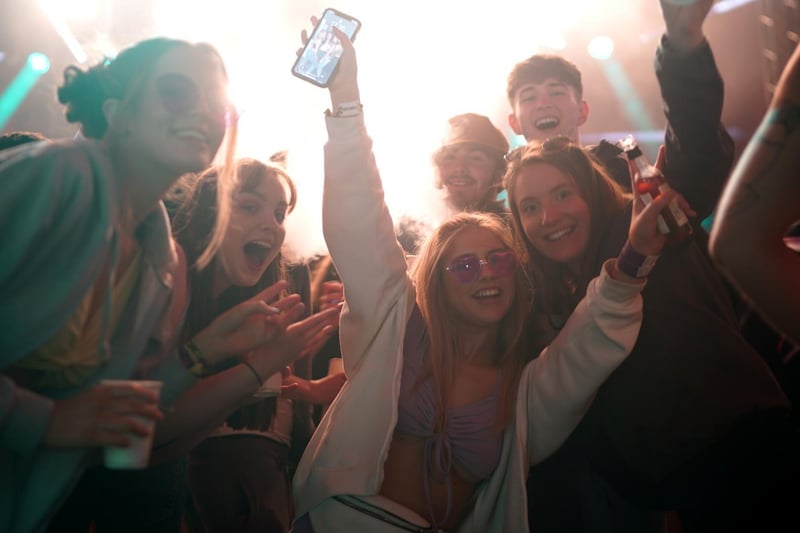Concert-goers enjoy a non-socially distanced outdoor live music event at Sefton Park on May 2, 2021 in Liverpool.