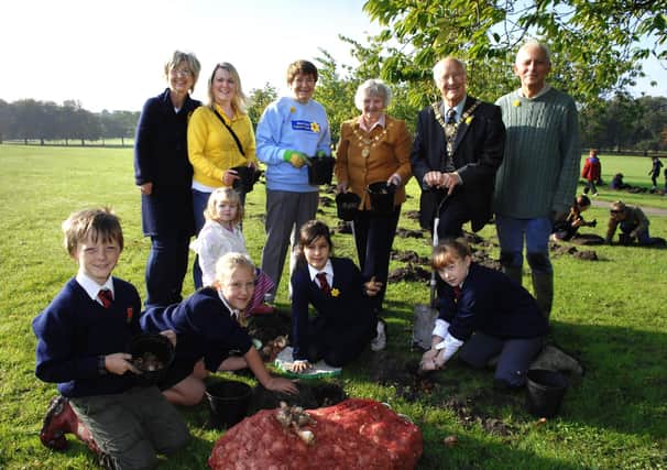 Pupils from St Peter's Church of England School help with bulb planting on the Stray for Marie Curie's Field of Hope. Also hands on with the planting were Liz Ramus, Charlene Greensword and her daughter Kitty Rose, Pat Nash, and the Mayor & Mayoress of Harrogate Bill and Vanessa Hoult.