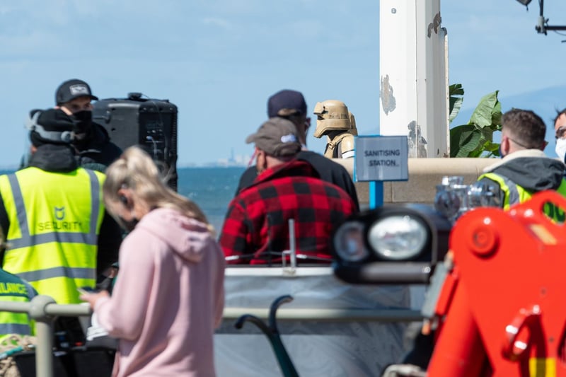 Sanitising stations are based around the promenade set, with security guards, production crews, actors and Stormtroopers enjoying a day in sunny Cleveleys as filming for Andor continues.
