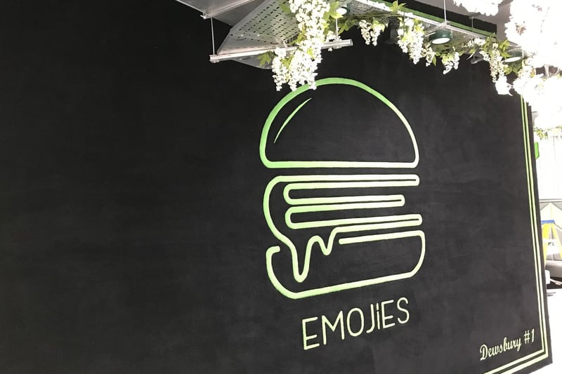 A feature carpet wall with the Emojies logo