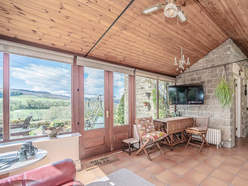 A light and spacious room to relax in with stunning views across the greenery.