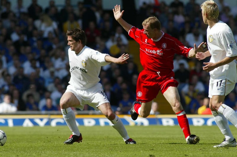 Harry Kewell shields the ball from Middlesbrough's Colin Cooper.