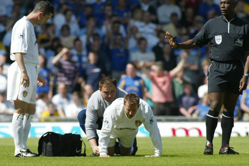 An injured Lee Bowyer receives treatment.