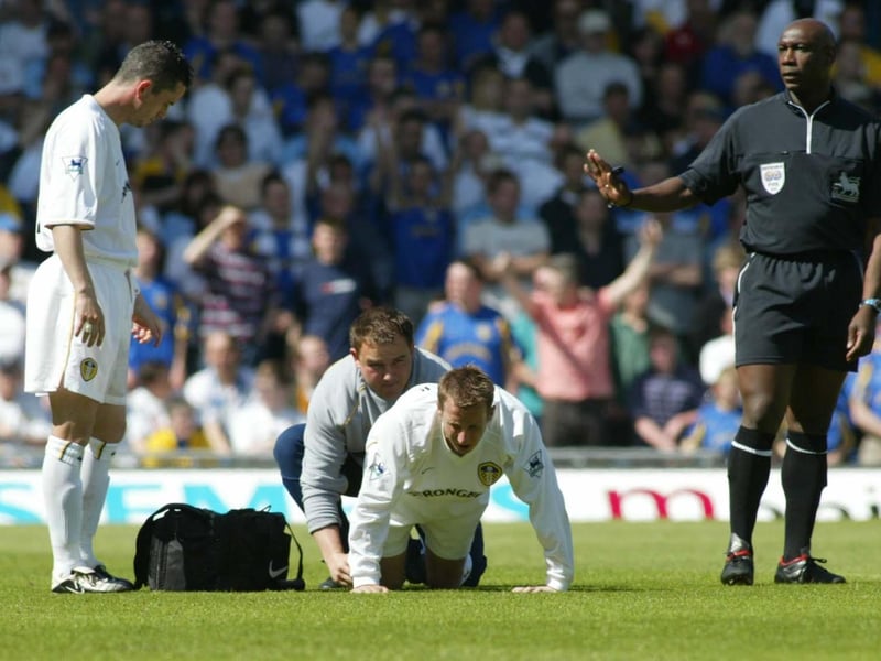 An injured Lee Bowyer receives treatment.