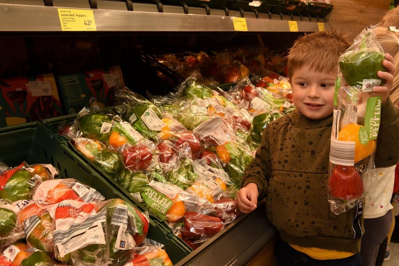 The children have been learning about healthy eating and James browsed the fruit and veg at the store opening, photo by Neil Cross.