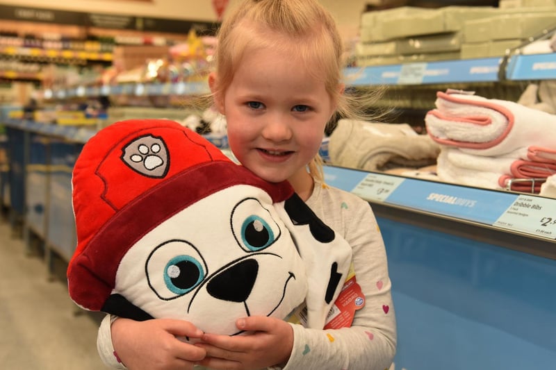 Ava finds a friend in the special buys section, photo by Neil Cross.