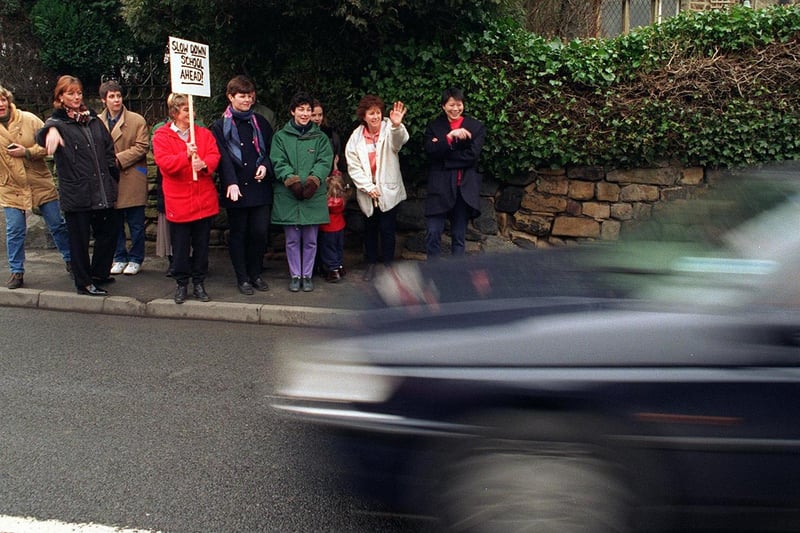 Parents encourage drivers to slow down outside Hawksworth Primary in February 1997.