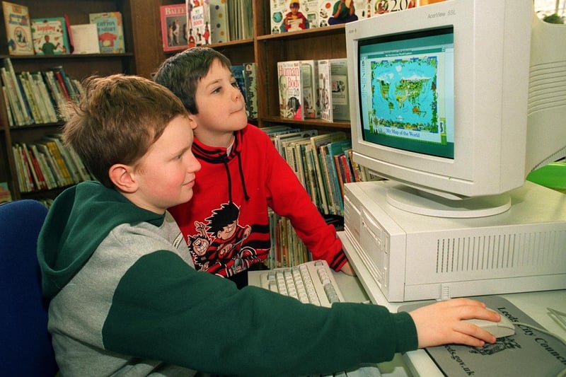 Scott Banks (left) and Paul Richards try out a new CD ROM service launched at Guiseley Library in February 1997.