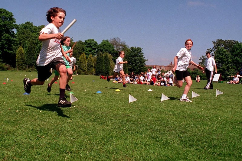 Pupils pictured running a 60 metre relay race during an inter-school Olympics at St Oswald's C of E Junior School in Guiseley in June 1997.
