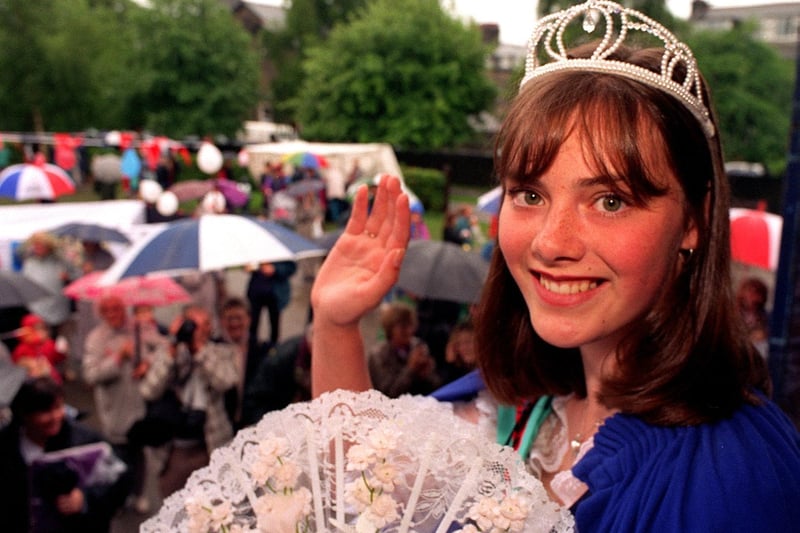 A happy smile in spite of the rain from Guiseley Carnival queen Gemma Hayton in June 1997.