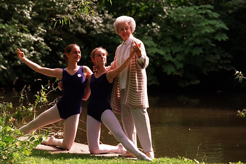 Prima ballerina Dame Alicia Markova gives tips to youngsters, Emily Acomb (left) and Grace Howarth while attending the ballet summer school at Ilkley College in July 1997.
