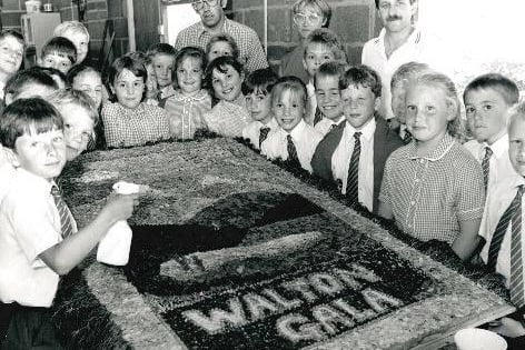 Walton Junior School – pupils with an example of a well dressing