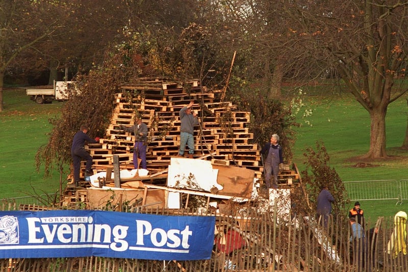 Nove,ber 1996 and workmen add more material to the Yorkshire Evening Post sponsored bonfire in Roundhay Park.