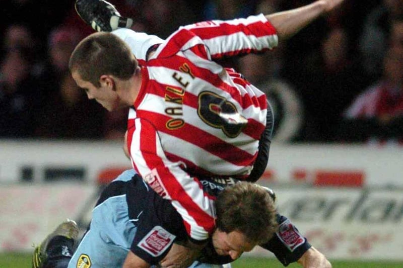 Southampton's Matt Oakley takes a tumble over Eddie Lewis.