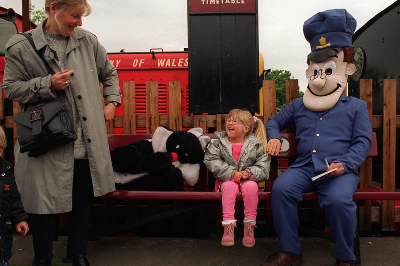 Chloe Bottom meets Postman Pat and his cat Jess at Middleton Railway in May 1997.