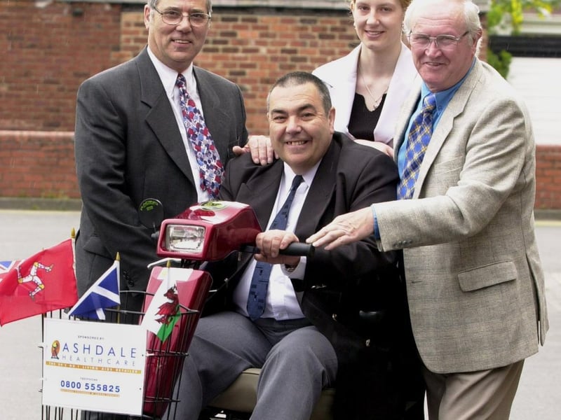 Record breakers Tony Palmer (seated) and Geoff West (right), who hold the record for the longest distance on a disability scooter, opened Ashdale Healthcare in the Crossgates Shopping Centre.