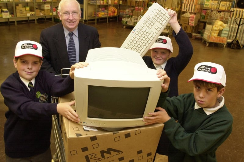 George Mudie MP presents Tesco computers to pupils from St Theresa's RC School, Swarcliffe Primary and White Laith Primary for their schools in October 2001.