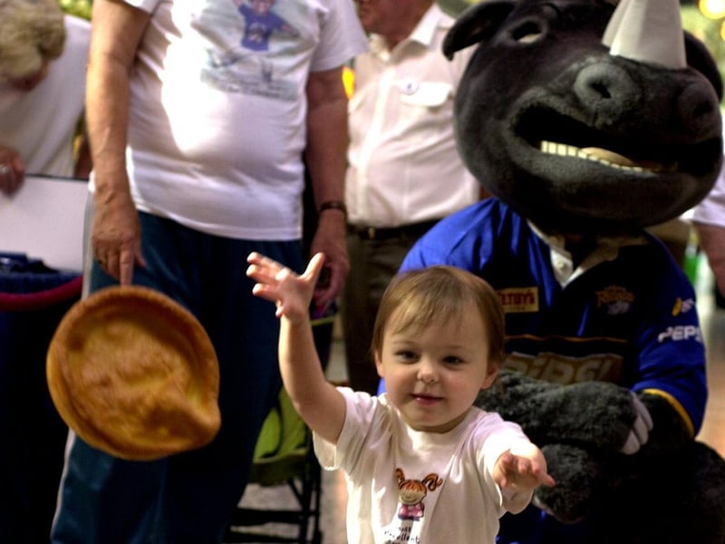 Crossgates Shopping Centre hosted a Yorkshire Pudding Throwing competition on Yorkshire Day 2001 in aid of the Martin House Teenage Unit. Pictured is young Lucy Brook having a go.