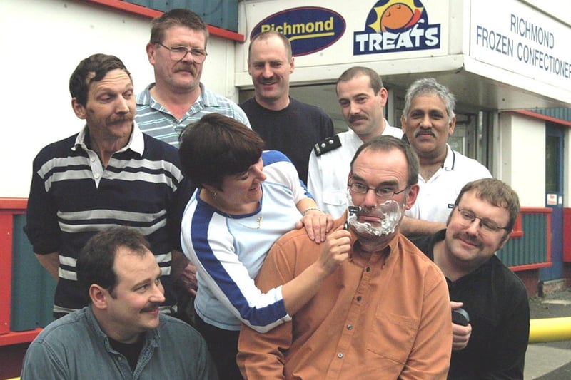 Credit controller Jackie Brook gets to work shaving a much-loved moustache from Richmond Frozen Confectionary finance director Andy Finneran and other staff. They raised £800 for Children In Need.