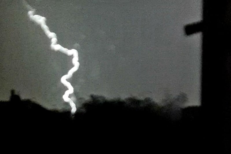 A huge bolt of lightning struck the ground just as Coleen Clayphon took this photo.