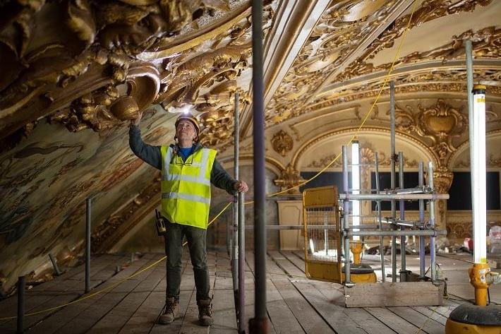 They have dedicated more than 21,000 hours over a period of six months, each climbing an average of 85 flights of scaffolding every day, to restore the ballroom to its original glory.