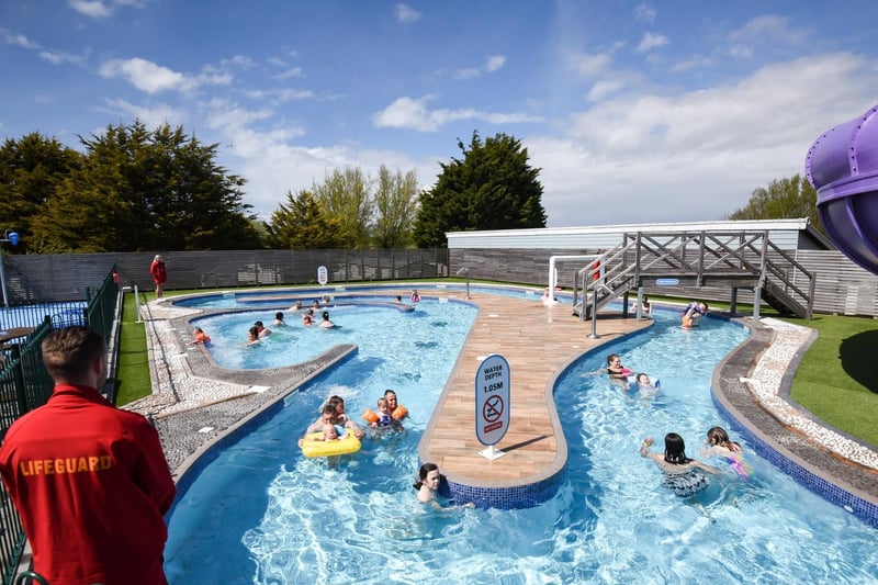 The outdoor pool and water activities area at Marton Mere holiday park.