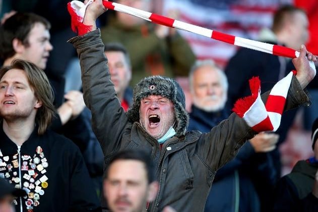 Barnsley's fans cheer on their team at Oakwell.