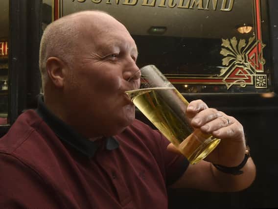 Martin Womersley enjoys his first pint inside a pub since lockdown at Whitelocks, Leeds (photo: Steve Riding)