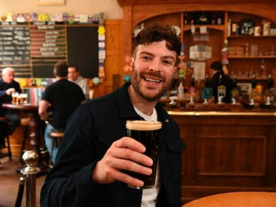 Radio One DJ and former I'm a Celebrity contestant Jordan North enjoys a pint at the Guild Ale House in Preston