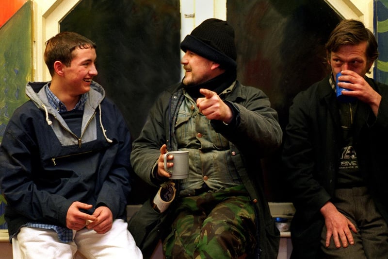 January 1997 and homeless people enjoy a coffee and a chat together at St Georges Crypt.
