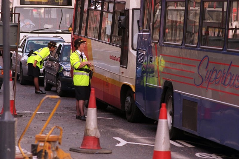 August 1997 and traffic wardens try to solve the traffic congestion on Vicar Lane caused by the introduction of a new two way system.