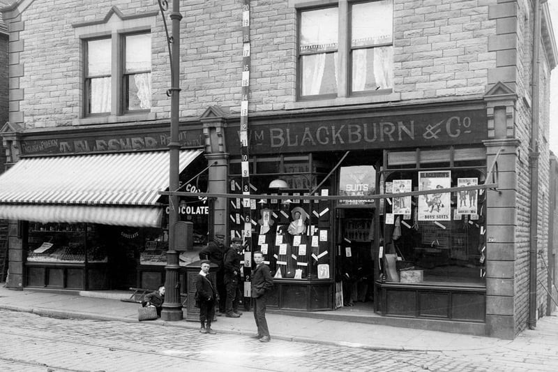Town Street in May 1906. On the left is the business of John Myers, greengrocer. Next is clothiers William Blackburn and Co.