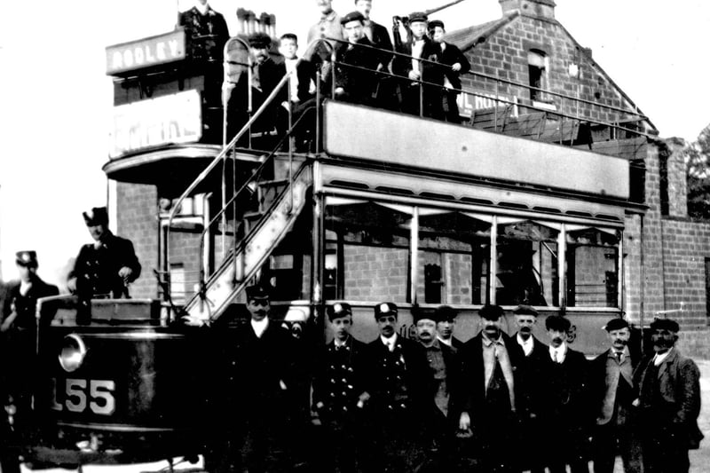 July 1906. One of the first tramcars from Leeds to Rodley at 5.30am. The number of the tram, 155, is on the front and staff at the Leeds depot are gathered around the tram track which had been laid by unemployed labour.