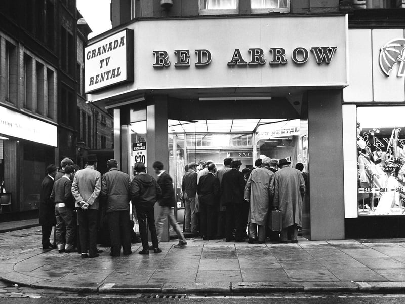 England fans gather round a television set in the window of a Leeds shop to watch the World Cup in 1966.
