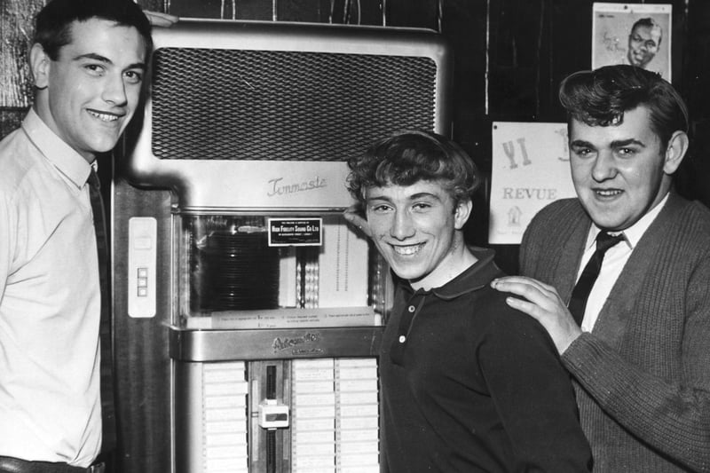 Inside Osmondthorpe Youth Club in July 1966. Pictured with the club's jukebox are, from left, John Knight, Stephen Mortimer and Brian Garth.