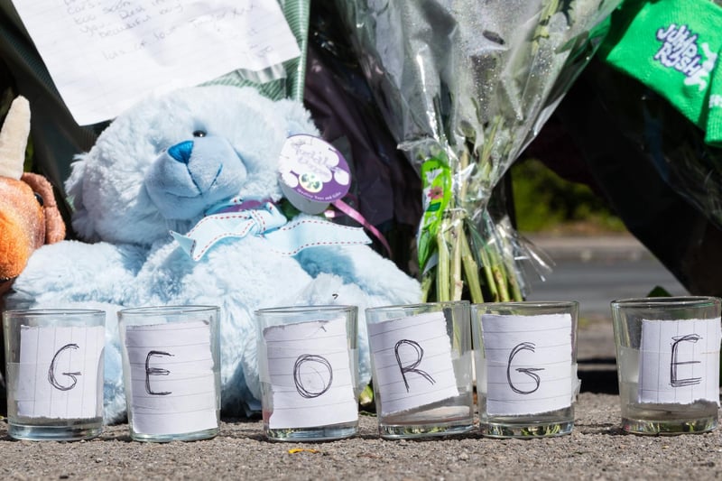 Candle holders with the name George spelled out across them were left in Mallowdale Avenue.