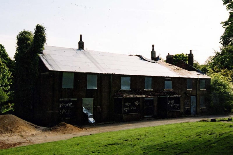 The derelict 'Top of the Wood' cottages in Middleton Park pictured in 2005.