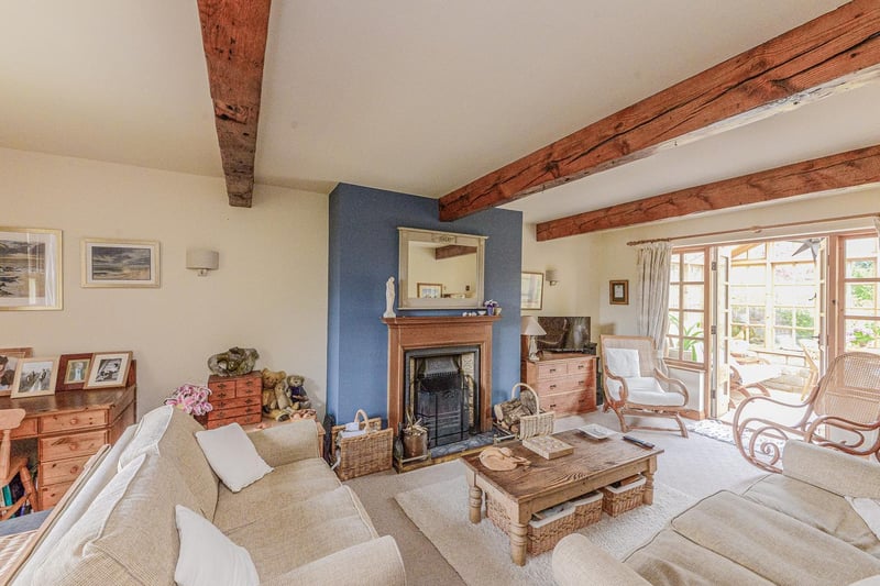 There is a large through lounge with exposed beams and open fire.