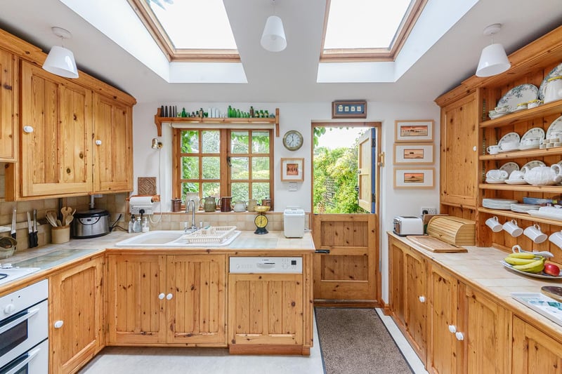 The country style kitchen with stable door opening to the garden.